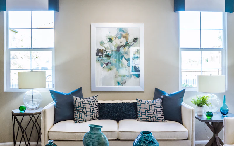 A calm, sunlit living space with a comfortable chair by the window